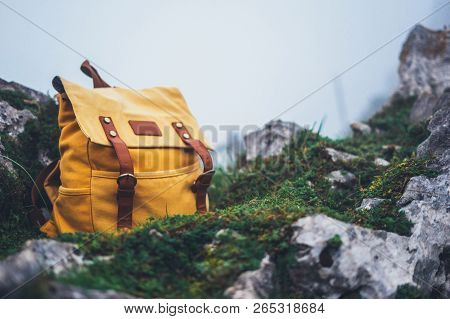 Hipster Hiker Tourist Yellow Backpack Closeup On Background Green Grass Nature In Mountain, Blurred 