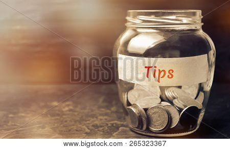 Glass Jar With Coins And The Inscription 