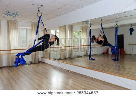 Fitness Rope Climb Cxercise In Gym. Young Woman Gymnast On Rope