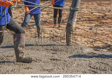 Pouring Ready-mixed Concrete From Mixing Mobile The Concrete Mixer From Concrete Pump And Placing Bo