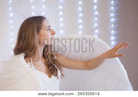 Girl In White Dress With Angel Wings On White Background. Angel-woman