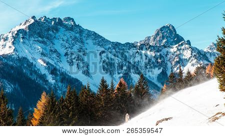 Sunny Winter Day With The Mountains Full Of Snow