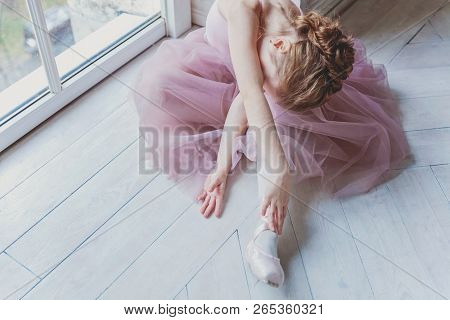 Young Classical Ballet Dancer Girl In Dance Class. Beautiful Graceful Ballerina Practice Ballet Posi