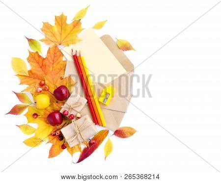 Autumn Background With Pencils, Envelopes And Colorful Leaves. Top View. Space For Your Text.