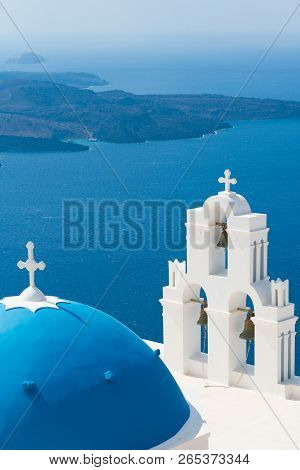 Sunset Over Aegean Sea With View To Virgin Mary Catholic Church Three Bells Of Fira, Santorini.