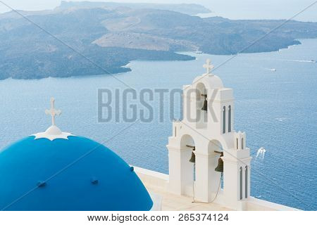 Sunset Over Aegean Sea With View To Virgin Mary Catholic Church Three Bells Of Fira, Santorini.
