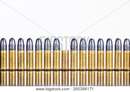 Series Of Cartridges Or Ammunition Against White Background, Concepts Such As Business Or Arms Expor