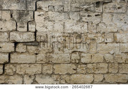 Old Destroyed Stone House On The Yard With Trees Around. Poverty And Misery, South, Summer