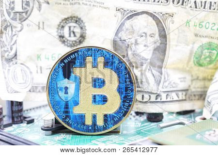 Crumpled Dollar Money And  Bitcoin In The Motherboard