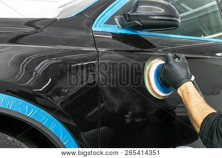 Car Polish Wax Worker Hands Applying Protective Tape Before Polishing. Buffing And Polishing Car. Ca