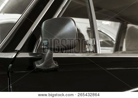 Background - Rearview Mirror And Door Fragment Of A Vintage Black Car