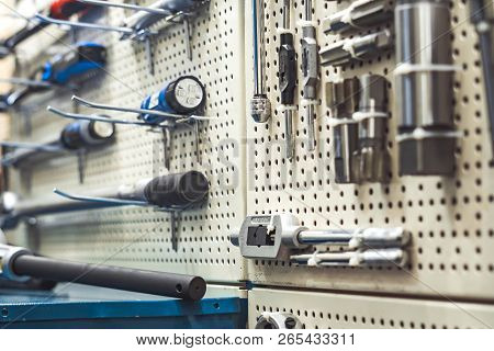 Electric Tools For Construction On The Stand In The Shop