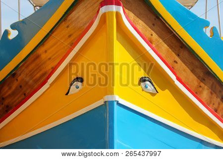Traditional Painted Eyed Boats Luzzu In Fishing Village Marsaxlokk, Malta In Sunny Day. Front View, 