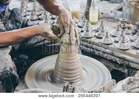 Close Up Professional Potter Hand Making Thai Style Pot Lid On A Potter Wheel In Pottery Villages At