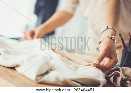 Fashion Designer Woman Working On Her Designs In The Studio.