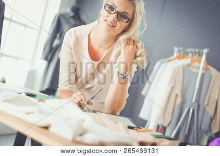 Fashion Designer Woman Working On Her Designs In The Studio.