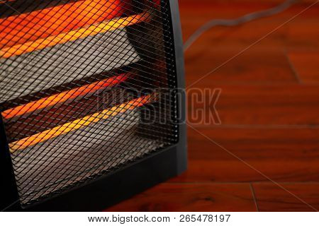Electric Heater Working In A Room With Copy Space