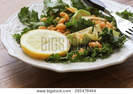 Vegan Salad With Avocado, White Bean And Vinaigrette Dressing . Top View