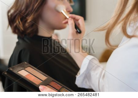 Closeup Of Professionsl Makeup Artist Applying Eyeshadows With Brush