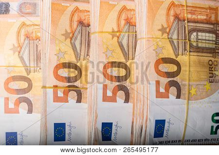 Pile Of 50 Real Euro Notes 50-euro Banknotes Under Rubber Band Isolated. About 20000 Euros Worth.