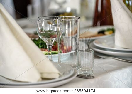 Beautiful Table Setting With Crockery And Flowers For A Party, Wedding Reception Or Other Festive Ev