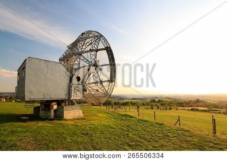 Satellite Dish In A Summer Landscape, Sky Background.