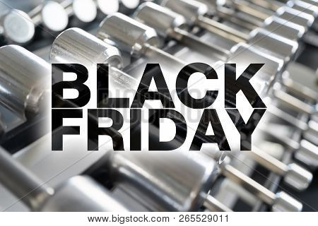 Black Friday Poster. Rows Of Dumbbells In The Gym With Hign Contrast Light