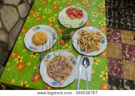 Meal In Baracoa, Cuba. Shrimps, Rice, Bananas, Vegetables And Mojito.