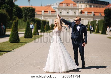 Groom Dance With Bride In The Pakr Near The Palace In Wiena, Austria