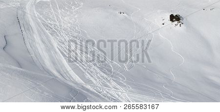 Panoramic View On Snowy Off-piste Slope With Traces Of Skis And Snowboards. Caucasus Mountains In Su