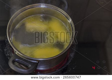 Cooking Of Marijuana Green Butter In Hot Water In Kitchen