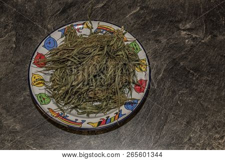 Cooking Of Marijuana Green Butter In Hot Water In Kitchen
