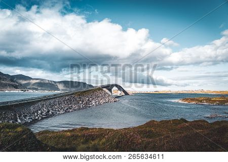 View Of Bridge Over The Sea And Mountains In Lofoten Islands, Norway. Hamnoy Ridge At Sunset In Wint
