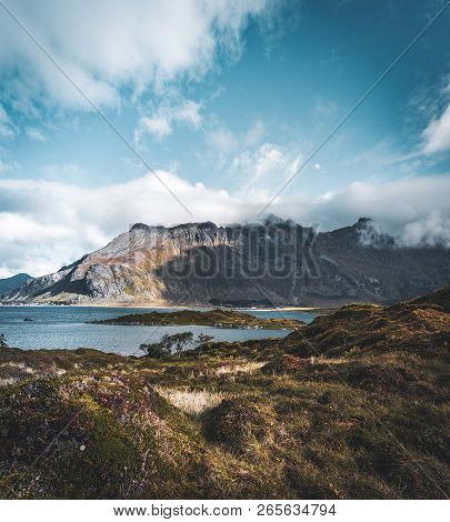 View Of Bridge Over The Sea And Mountains In Lofoten Islands, Norway. Hamnoy Ridge At Sunset In Wint