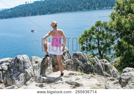 Young Woman Poses Portrait View Fanettte Island In Lake Tahoe California.