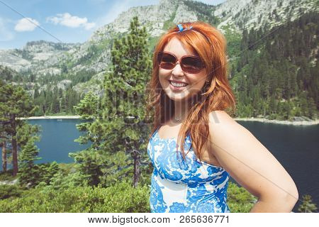 Young Woman Poses Portrait View Fanettte Island In Lake Tahoe California.