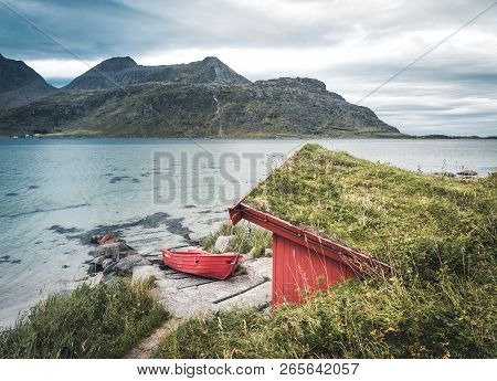 A Typical House Of The Fishermen Called Rorbu On The Beach Frames The Sea At Ramberg Lofoten Islands