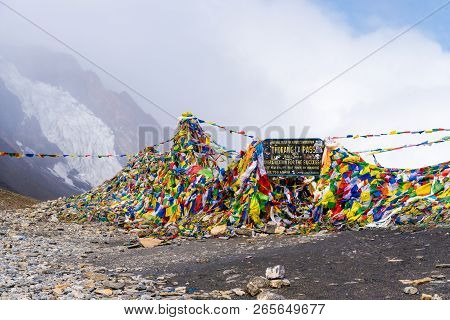Information Sign And Prayer Flags On Thorang-la Pass, Annapurna Conservation Area, Nepal