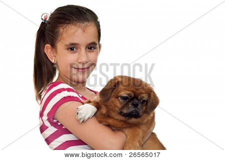Beautiful girl holding a small pekingese dog on a white background