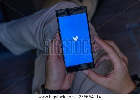 Chiang Mai, Thailand - Feb 13,2018: Man Holding Sony Xperia Xzs Mobile Phone With Twitter Logo On Th