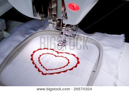 The sewing-machine costs on a table and is ready to work