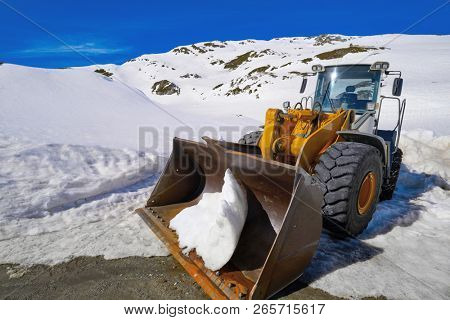 Snow clearing excavator in Aran Valley of Pyrenees in Spain