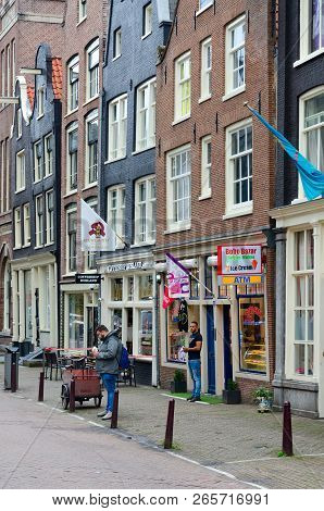 Amsterdam, Netherlands - September 6, 2018: Unidentified People Are Located Near Coffeeshop Rusland 