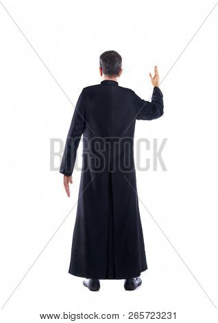 Full length priest blessing arm rear view of back soutane