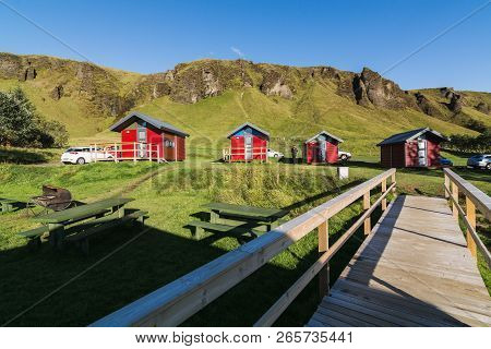 Kirkjubaejarklaustur, Iceland - August 2018: Red Timber Cottages For Rent On A Campsite.