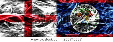 England Vs Belize, Belizean Smoke Flags Placed Side By Side. Thick Colored Silky Smoke Flags Of Engl