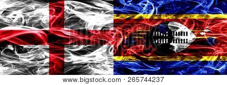 England Vs Swaziland, Swazi Smoke Flags Placed Side By Side. Thick Colored Silky Smoke Flags Of Engl