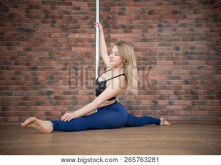 Girl Posing In A Pole Dance Studio