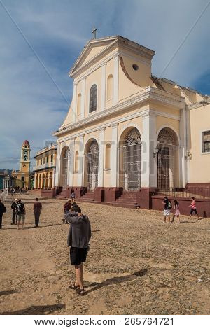 Trinidad, Cuba - Feb 8, 2016: Tourists In Front Of Iglesia Parroquial De La Santisima Trinidad Churc