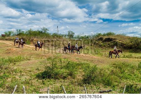 Guachinango, Cuba - Feb 9, 2016: Tourists During Horse Riding Trip In Valle De Los Ingenios Valley N